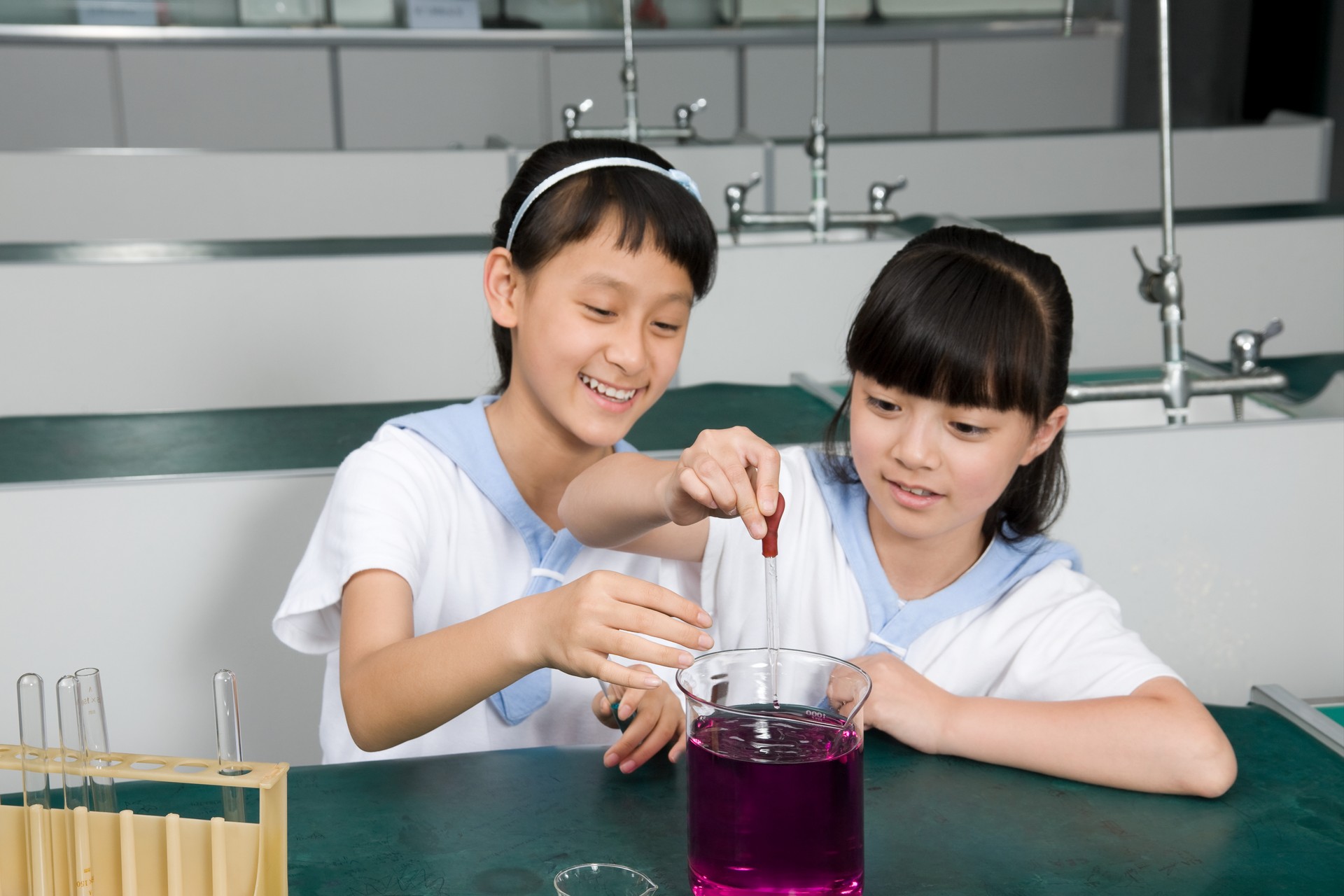 Image of Two girls doing an experiment